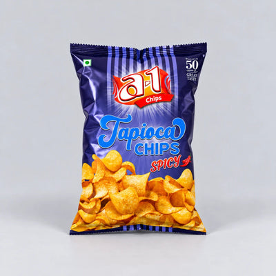 A bag of a1 Chips Tapioca Chips Spicy, featuring a dark blue packaging with a graphic of golden-brown chips at the bottom, set against a neutral gray background.