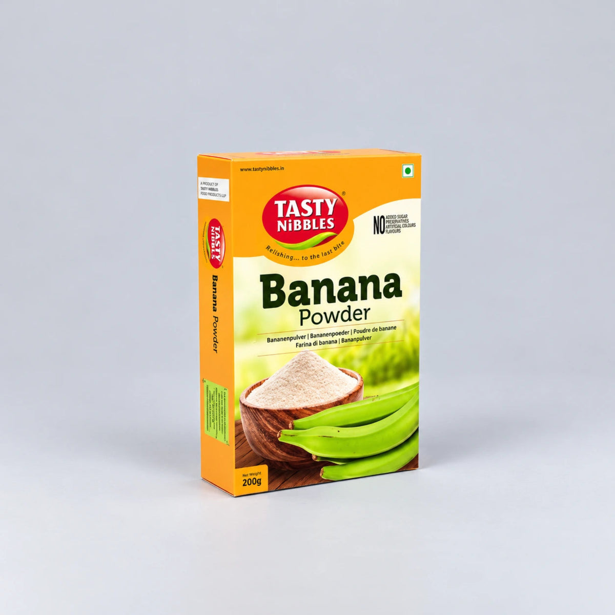 A 200g box of Tasty Nibbles Banana Powder, featuring a bright orange and white packaging design with an illustration of a banana and fresh green bananas.