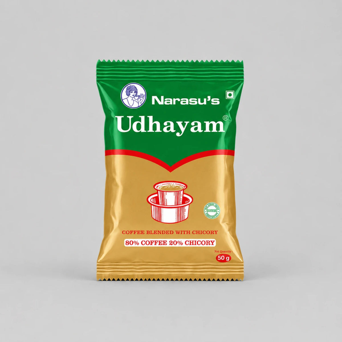 A 50g packet of Narasu's Udhayam coffee blend, featuring a green and gold design with a red chevron and an illustration of a cup of coffee.