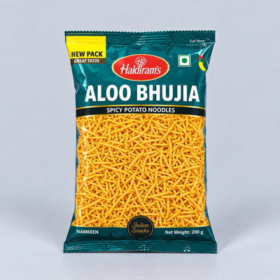A 200g bag of Haldiram's Aloo Bhujia Spicy Potato Noodles, featuring a dark teal packaging with a clear window showing the golden-yellow fried potato stick pieces inside.