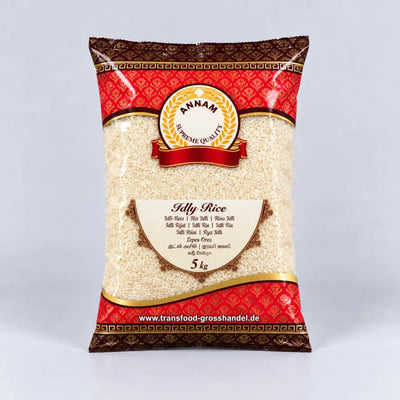 A 5 kg bag of Annam Supreme Quality Jilly Rice, featuring a red and gold patterned packaging design with a clear window showing the rice inside, set against a light gray background.
