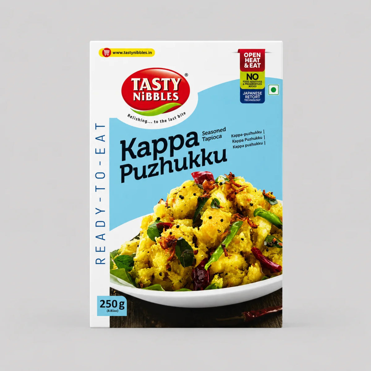 A package of Tasty Nibbles Kappa Puzhukku (seasoned tippukku) ready-to-eat snack mix, featuring a white and light blue box with a photo of the prepared yellow snack dish.
