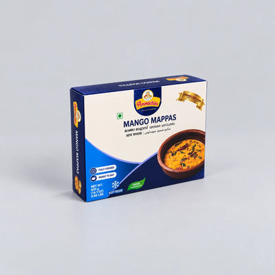 A box of Darjeesh Mango Mappas (sweet mango pancakes) on a light gray background. The packaging is primarily blue and white with a photo of the golden-brown cooked mango mappas in a bowl on the front.