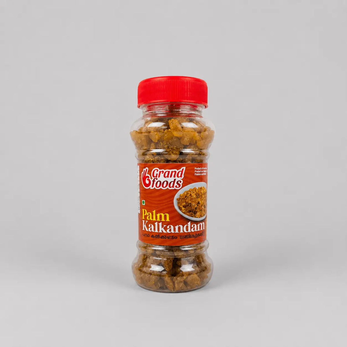 Bottle of Grand Foods Palm Kalkandam on a gray background