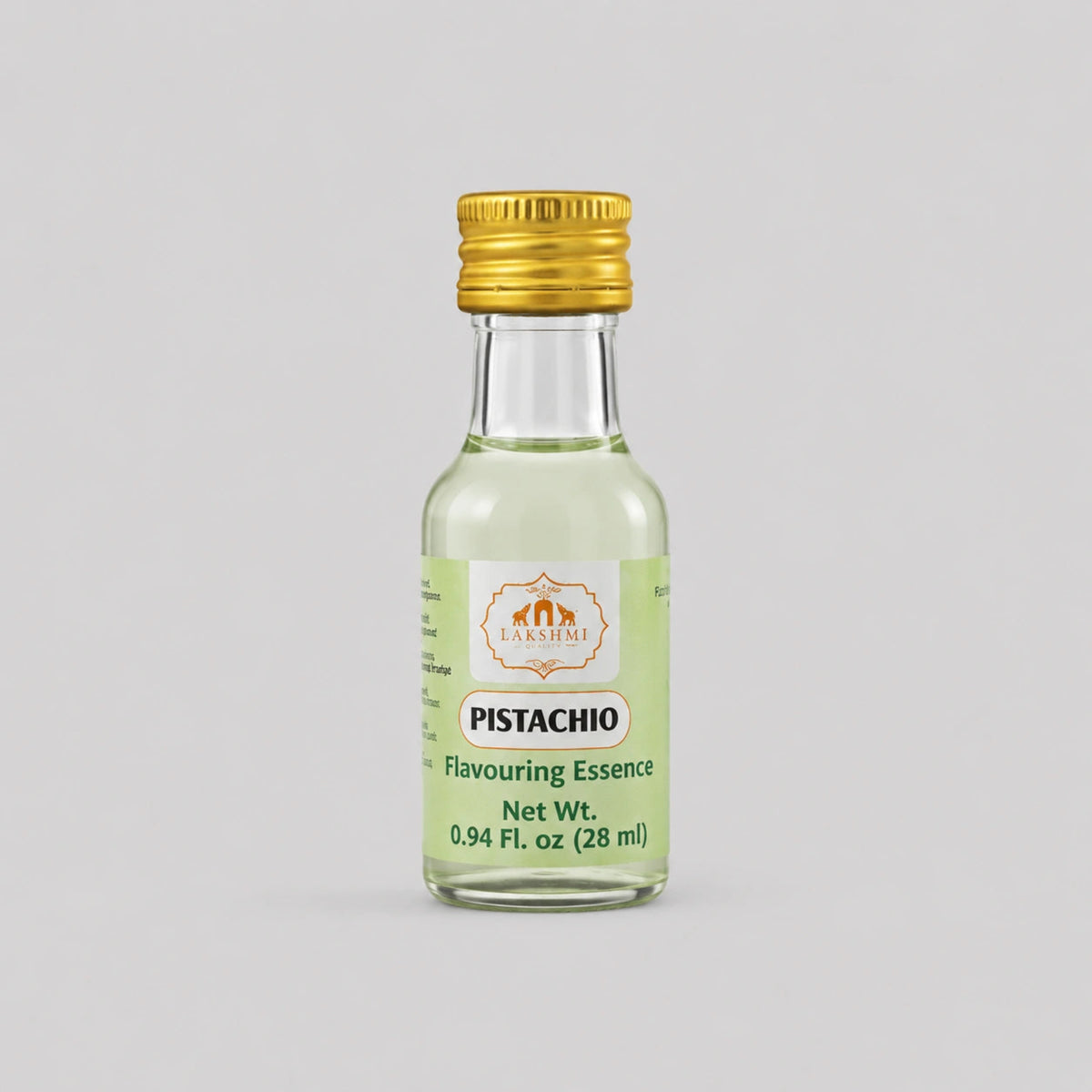 A small glass bottle of Pistachio Flavouring Essence with a gold cap and a light green label, centered on a solid gray background.