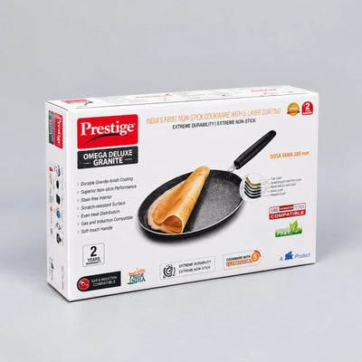 Prestige Omega Deluxe Granite non-stick cookware box, showing the retail packaging for a 2-piece set with a dosa pan and spatula on a light gray background.