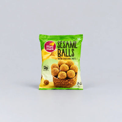 A package of Mahi Mark Sesame Balls sweet snacks, featuring a green and yellow bag with an illustration of golden-brown sesame balls in a basket, set against a plain light gray background.