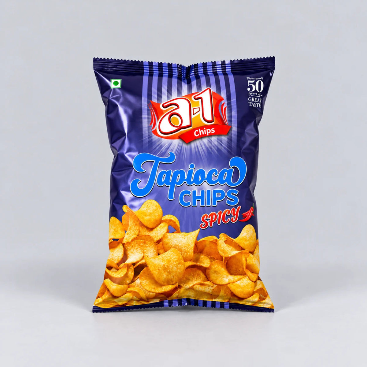 A bag of a1 Chips Tapioca Chips Spicy, featuring a dark blue packaging with a graphic of golden-brown chips at the bottom, set against a neutral gray background.
