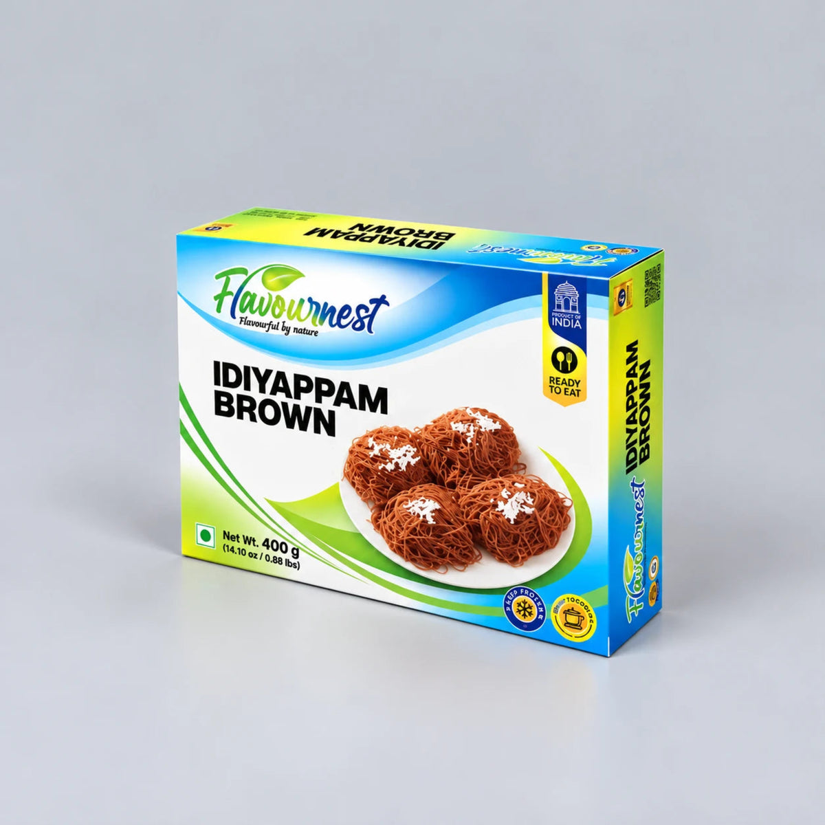 A box of Flavournest Idiyappam Brown (Chivda) on a light gray background. The packaging is blue, white, and green, featuring an image of four brown idiyappam balls on a white plate.