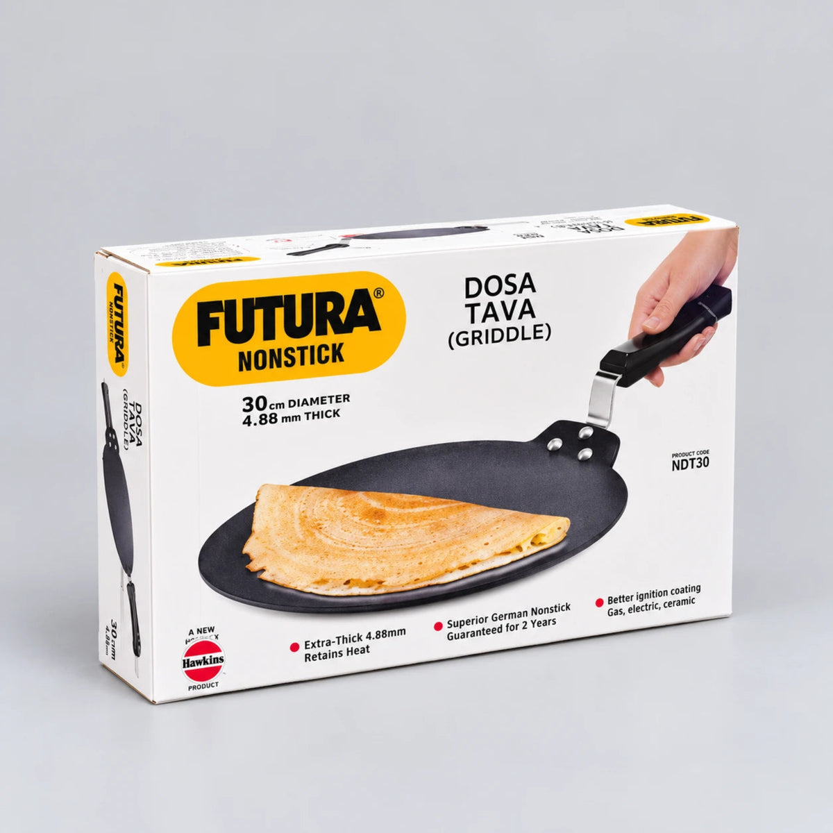 Futura Nonstick Dosa Tava (Griddle) in its original retail packaging, featuring a white box with yellow and black branding and a photo of a golden-brown dosa on the nonstick pan.