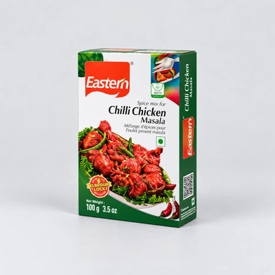 A 100g box of Eastern brand Chilli Chicken Masala spice mix, featuring a green and white packaging design with a photo of cooked red masala chicken on the front, set against a plain light gray background.