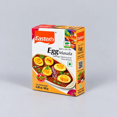 A box of Eastern Egg Masala spice mix, featuring a white and orange packaging design with an image of egg masala curry on the front, set against a neutral gray background.