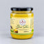 A 500 ml glass jar of Garam Desi Ghee with a black lid and a cream-colored label, set against a neutral light gray background.