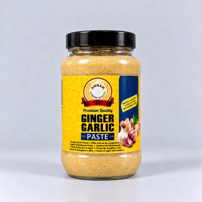 A glass jar of Annam Brand Ginger Garlic Paste with a black lid and a yellow label, set against a light gray background.
