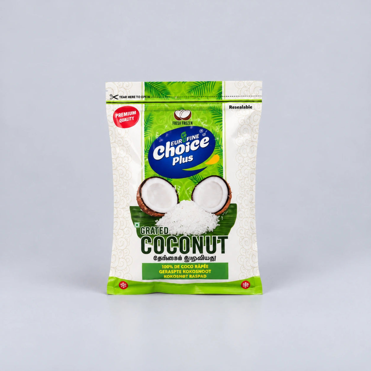 A bag of Fruit Fine's Choice Plus Grated Coconut, shown on a neutral light gray background. The packaging is primarily white with green accents, featuring a graphic of a halved coconut and white grated coconut powder.