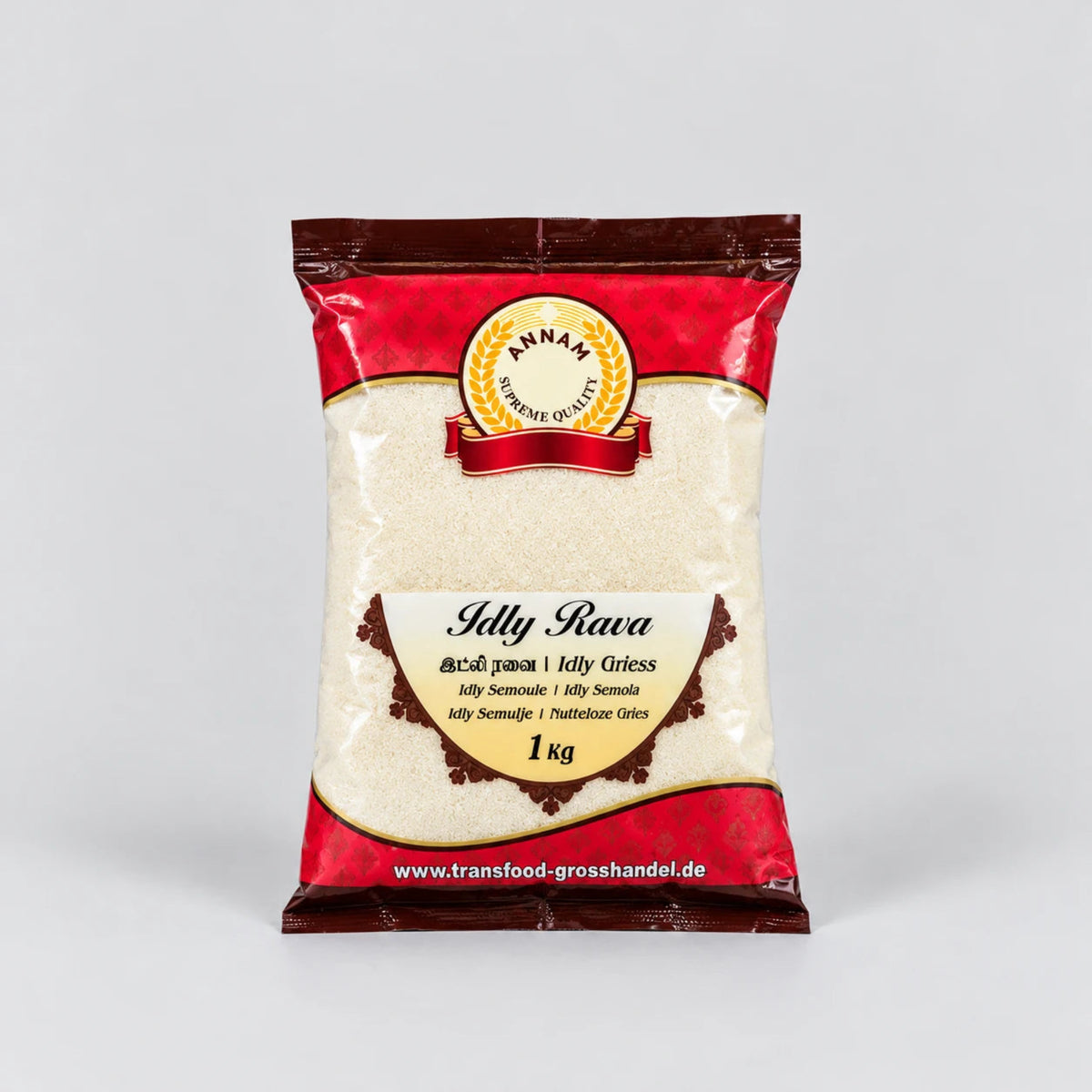 A 1 kg bag of Annam Premium Grised (Jelly Rava) on a light gray background. The packaging is red and dark brown with a clear window showing the off-white jelly grains inside.