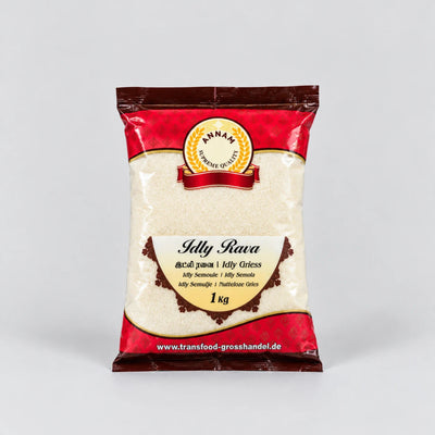 A 1 kg bag of Annam Premium Grised (Jelly Rava) on a light gray background. The packaging is red and dark brown with a clear window showing the off-white jelly grains inside.