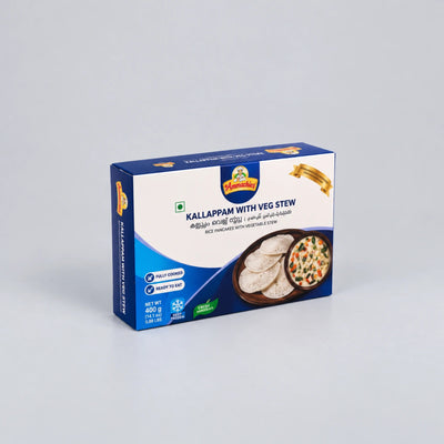 A box of Vennamichi Kallappam with Veg Stew, featuring a blue and white packaging design with a photo of the prepared food on the front, set against a neutral light gray background.