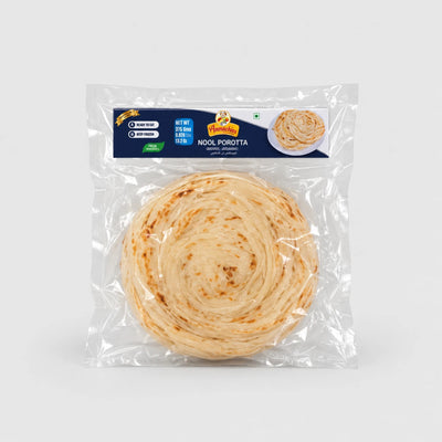 A packaged round flatbread, labeled 'NOOL POROTTA' by the brand Namaste, shown in a clear plastic bag against a light gray background.