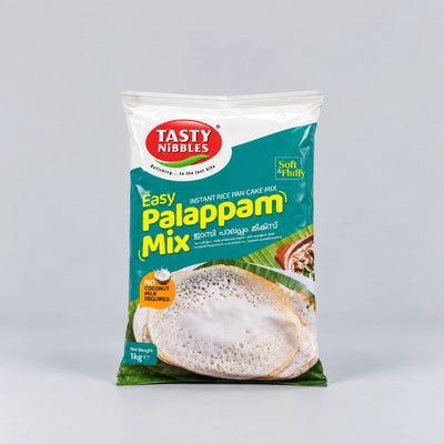 A 1 kg bag of Tasty Nibbles Easy Palappam Mix instant rice pan cake mix, featuring a green and white packaging design with a photo of cooked palappam on a light gray background.