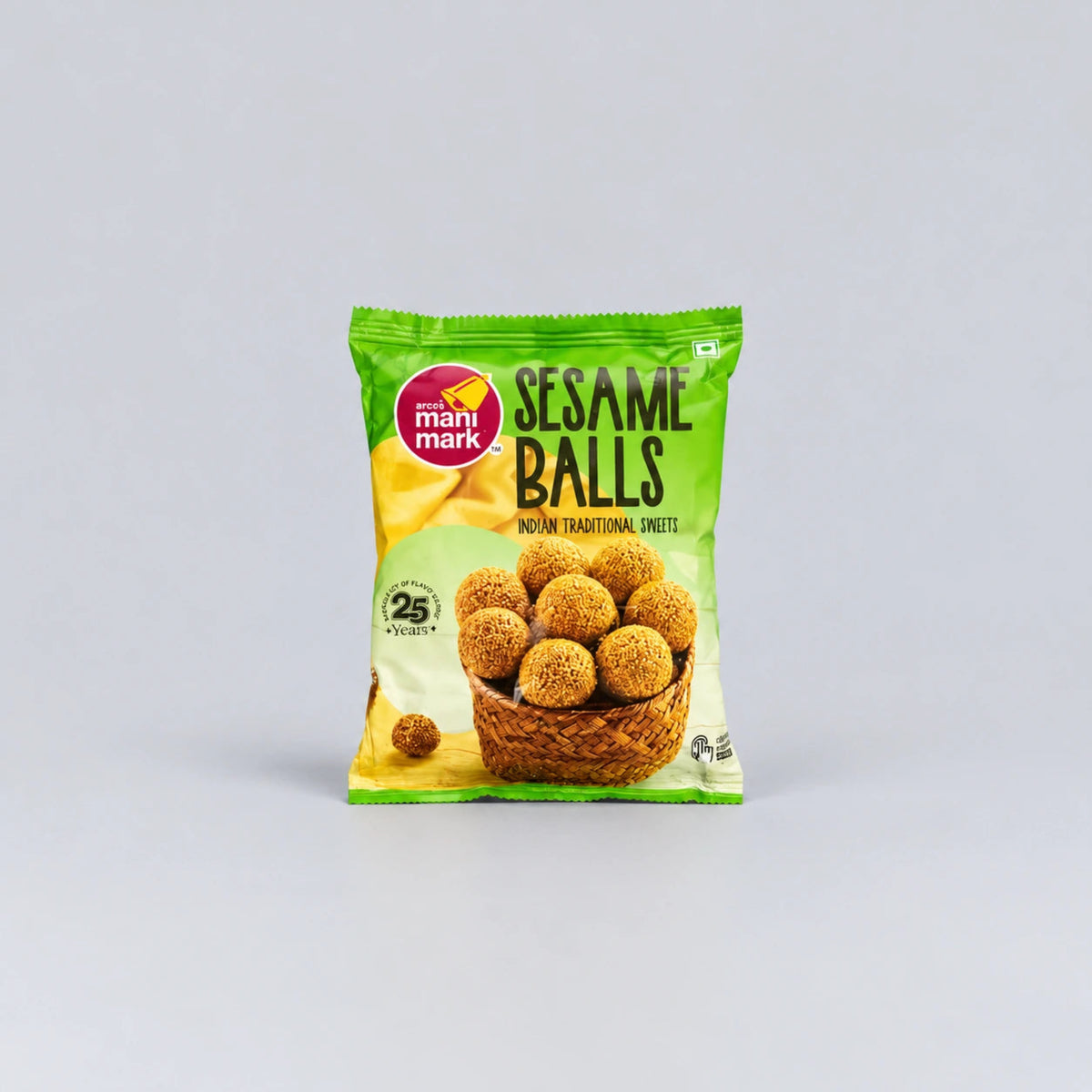 A package of Mahi Mark Sesame Balls sweet snacks, featuring a green and yellow bag with an illustration of golden-brown sesame balls in a basket, set against a plain light gray background.