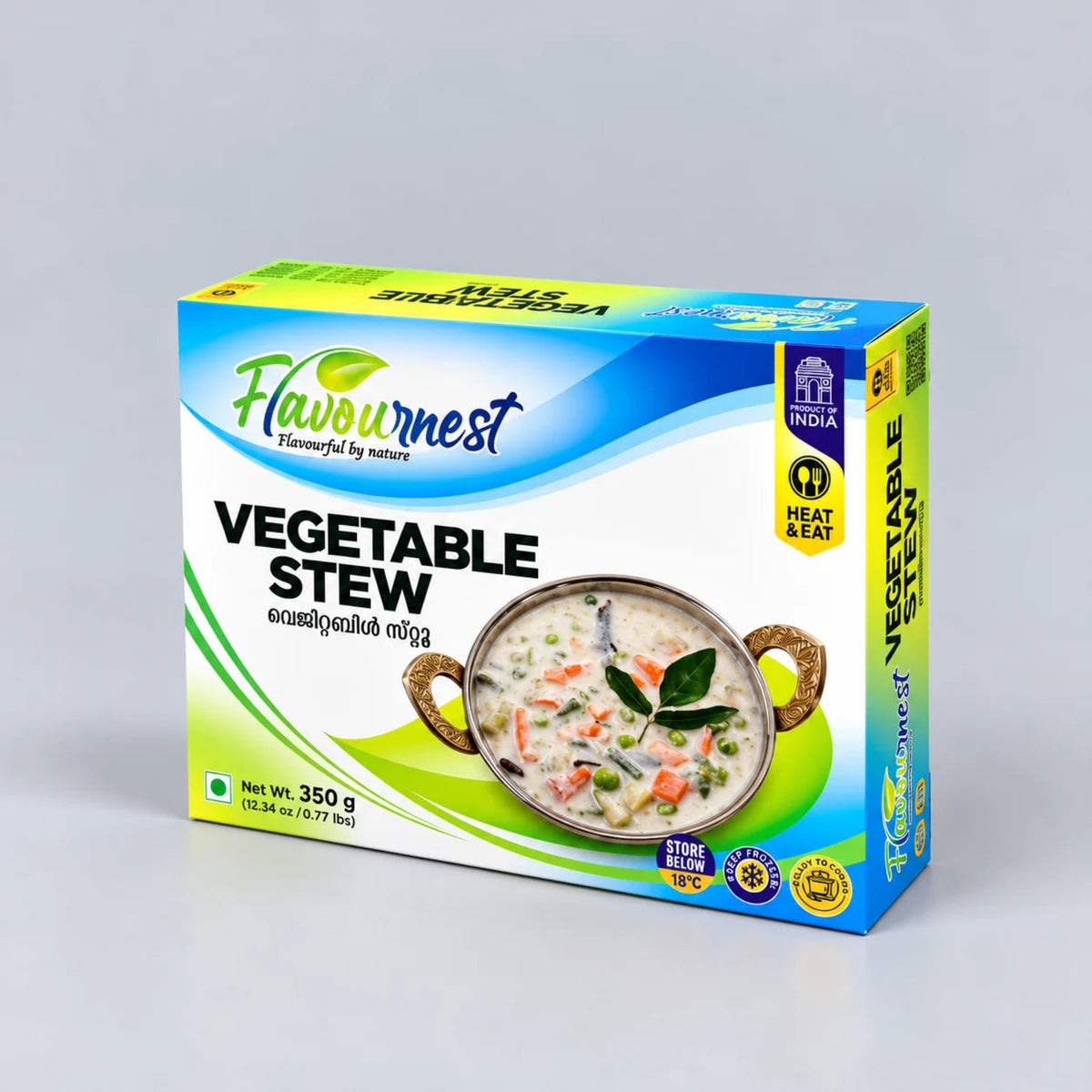 A box of Flavournest Vegetable Stew, 350g, photographed on a neutral light gray background. The packaging features a white base with blue and green wave graphics, a photo of the prepared vegetable stew in a pot, and a yellow 'India Heat & Eat' badge.