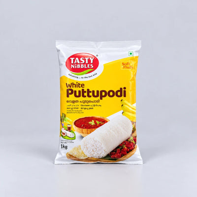 A 1 kg package of Tasty Nibbles White Putupodi, featuring a white and yellow bag with a red logo and an illustration of the prepared food, set against a plain light gray background.